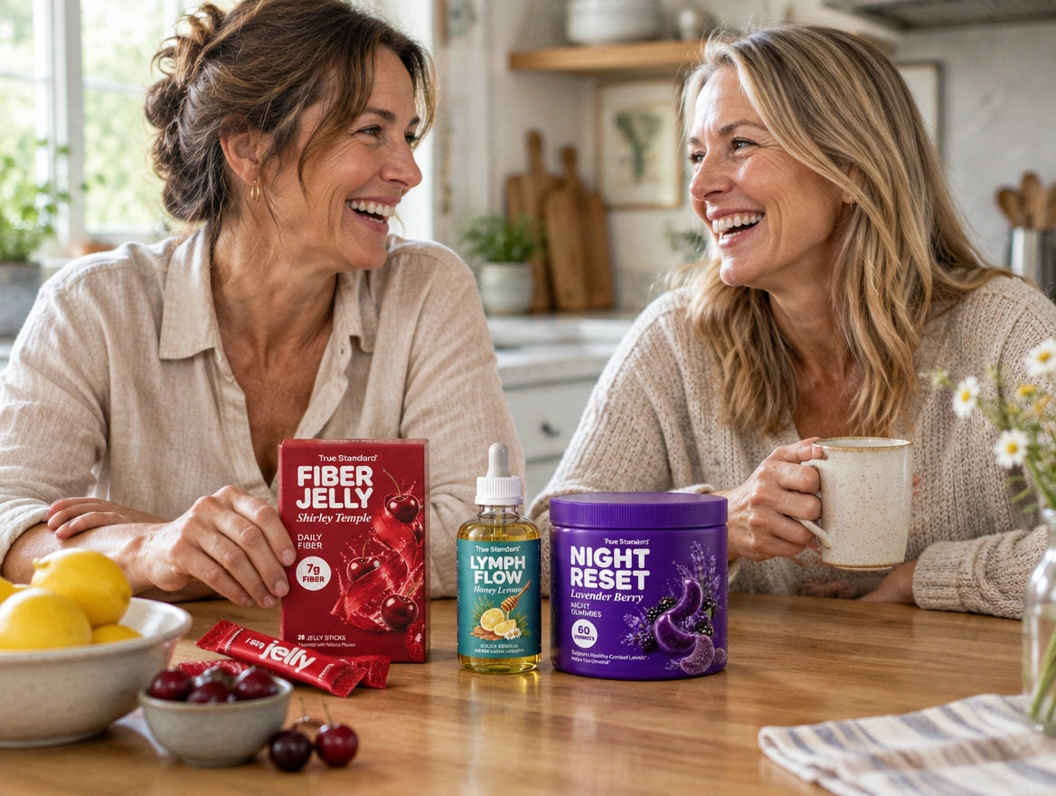 Two women at a kitchen table with True Standard products